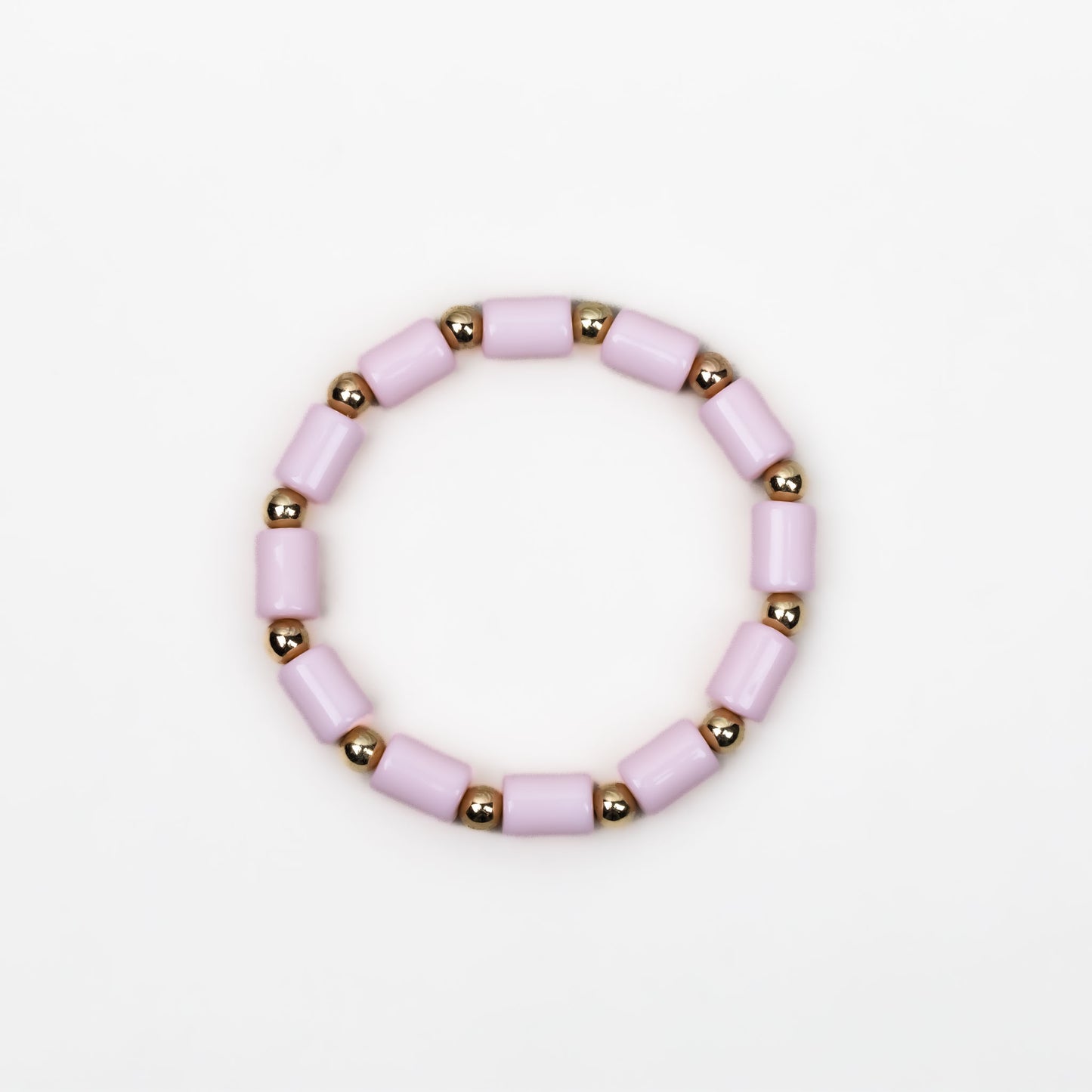 Brățară elastică cu mărgele cilindrice și biluțe aurii - Roz