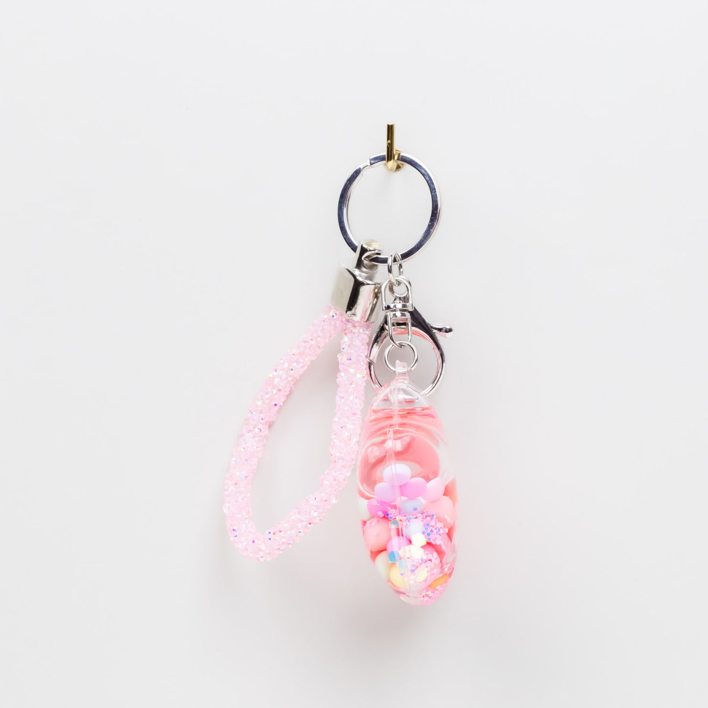 Breloc chei translucid în formă de stea cu lichid și confetti - Roz
