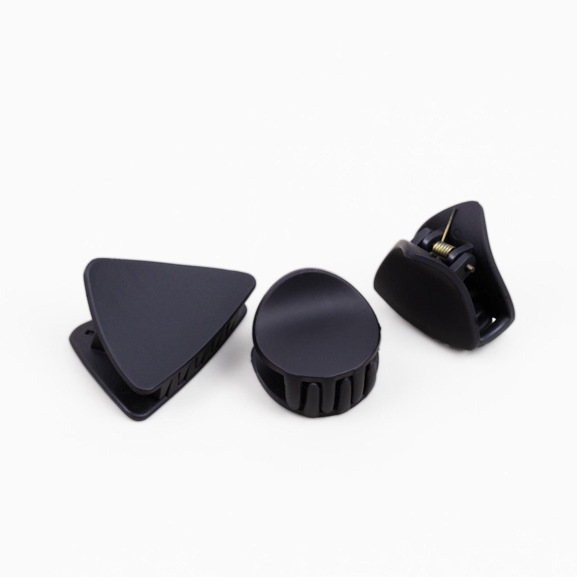 Clame de păr mici în cu forme geometrice și textură de silicon, set 4 buc - Negru