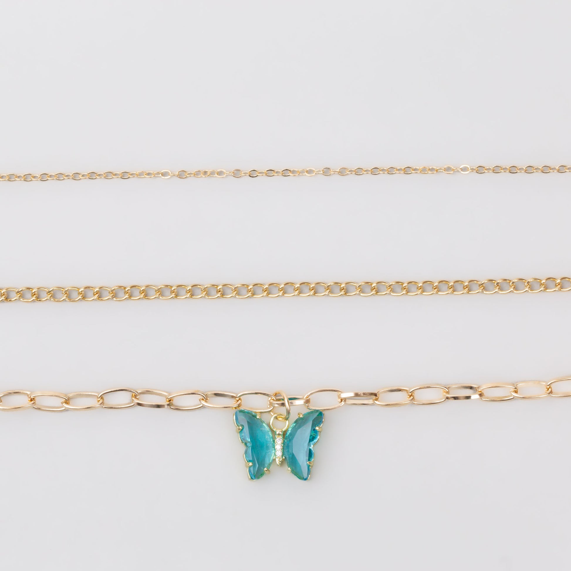 Coliere cu lanț auriu și pandantiv în formă de fluture cu pietre, set 3 buc - Albastru